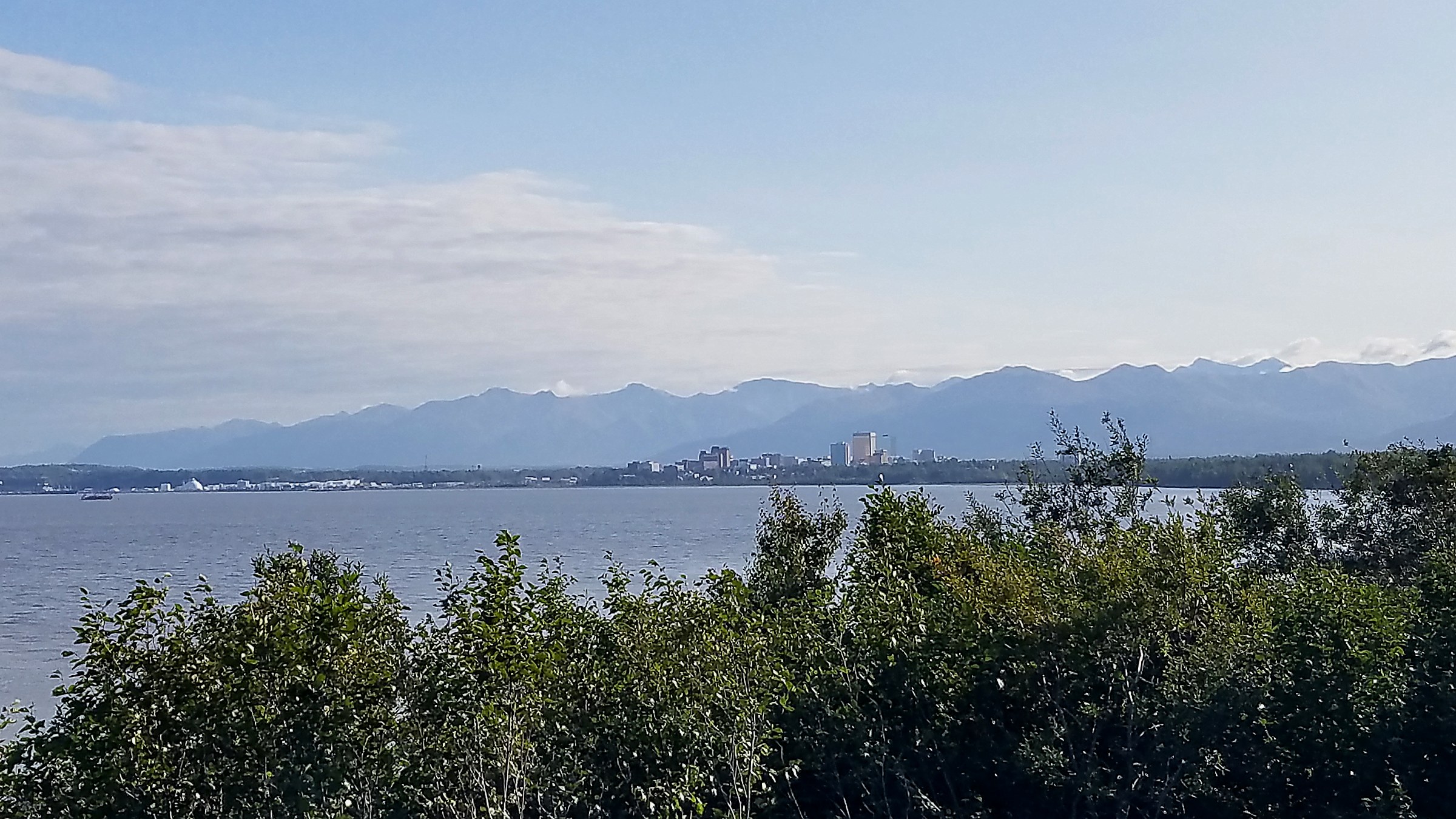 Anchorage from the coastline, Chugach mountains behind the city